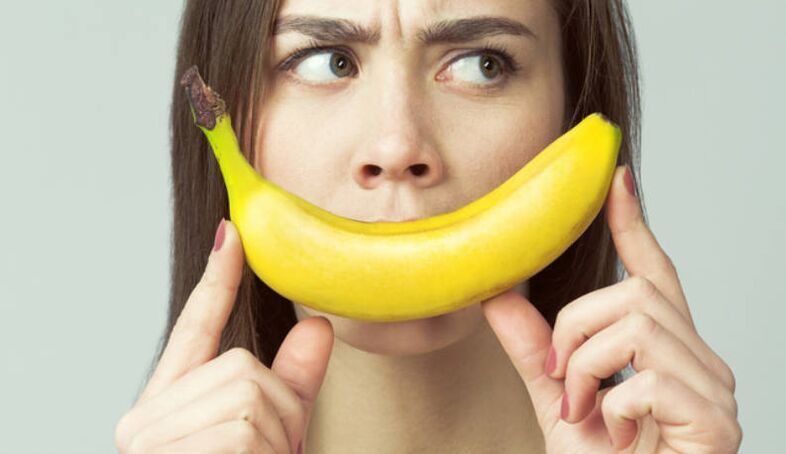 girl with banana imitates penis enlargement with massage